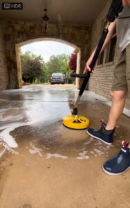 Man Washing Concrete Driveway in Edmond OK with Pressure Washing